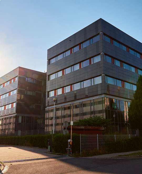 Modern office building exterior with glass architecture representing local business insurance solutions.